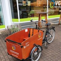 Ein Bild, das ein Lastenfahrrad enthält.